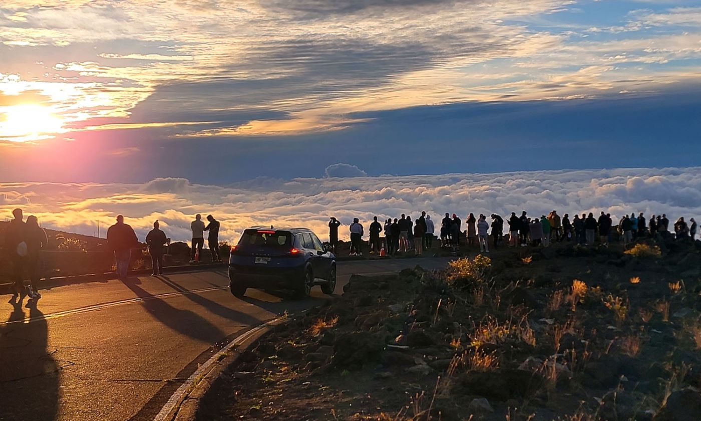 Sunset from the Haleakala summit above the clouds