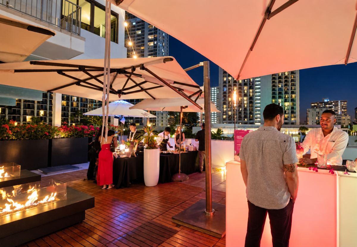 Chef stations and a bar on the ʻAlohilani pool deck at dusk