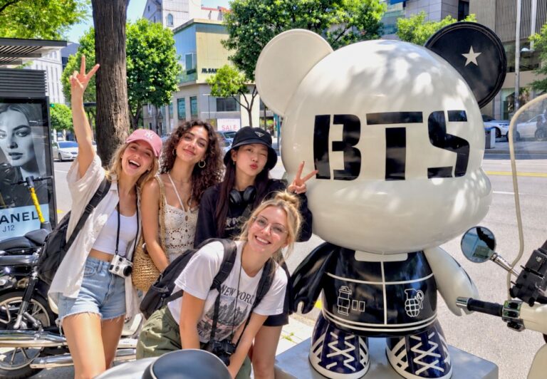 Travelers at a BTS landmark in Seoul